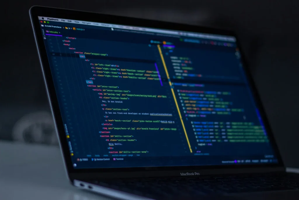 A code editor open on a laptop