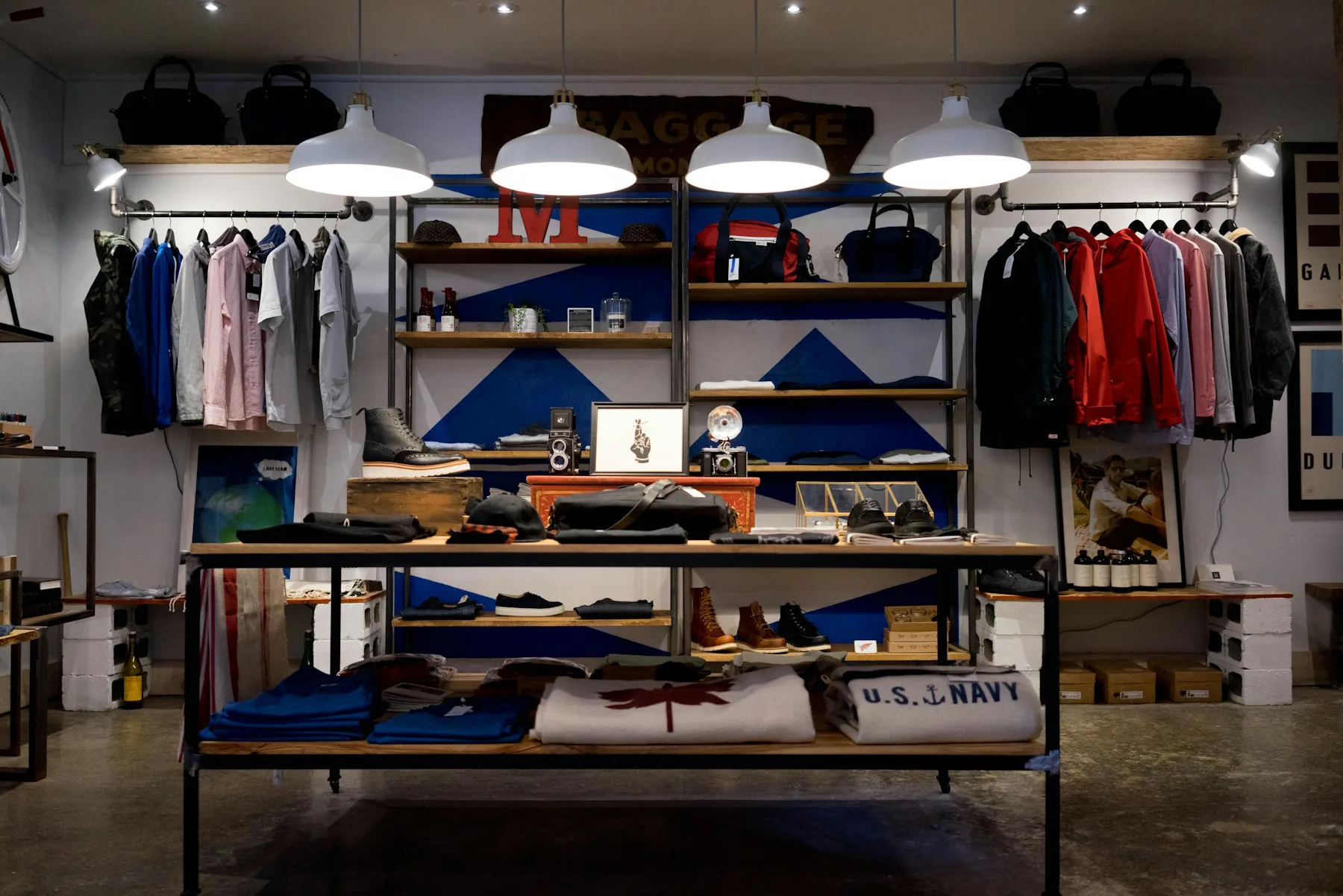 A clothing store interior with folded stock