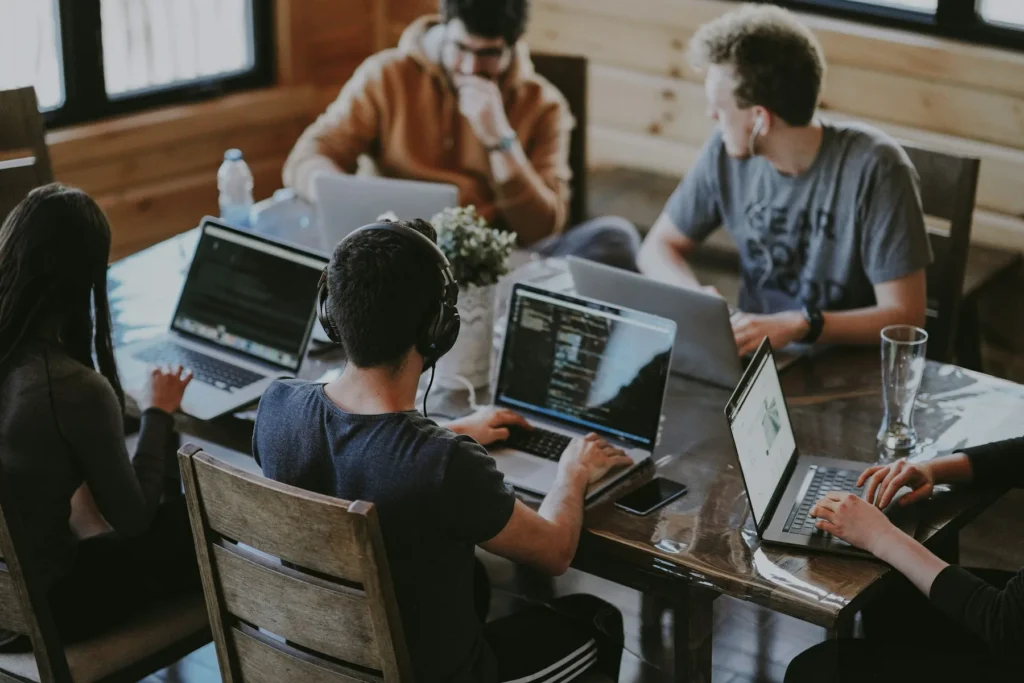 A small team working together at laptops